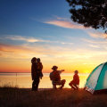 How does camping help you develop new skills and become more self-sufficient?